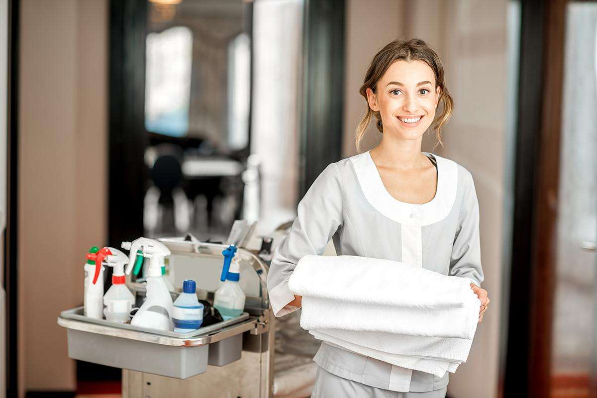 Chambermaid In The Hotel Corridor